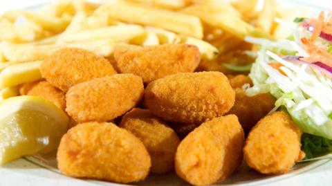 Fried scampi with chips and salad