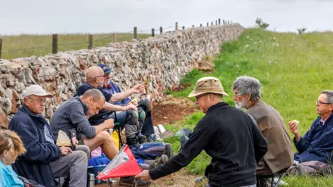 Mendip Hills AONB Drystone Wallers sat outside