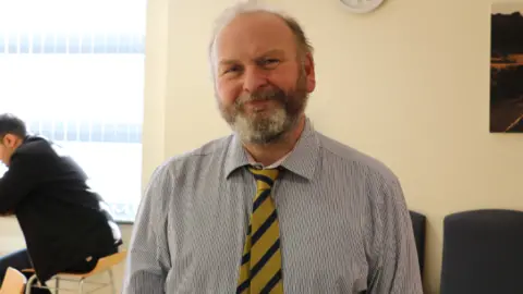 Daniel Hay pictured teaching as part of a basic surgical skills course in February 2019