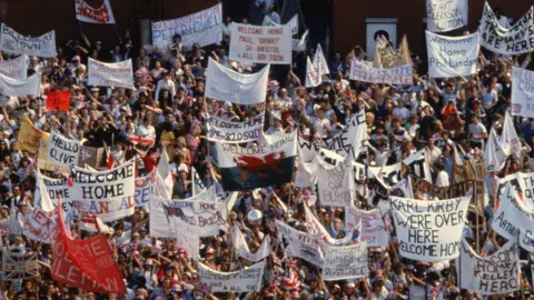 Getty Images Families and friends gather on the quayside as the HMS Invincible returns to Portsmouth, carrying British troops home from the Falklands War, 17th September 1982.