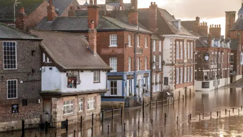 PA Media Flooding in York where the River Ouse has burst its banks