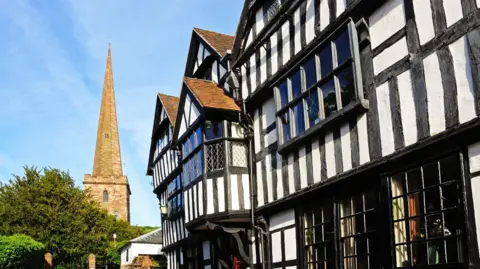 Caron B via Getty Images The parish church in Ledbury, next to an old building
