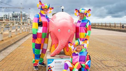 Organisers with Elmer sculpture on Blackpool Promenade
