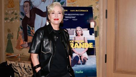Emma Thompson standing in front of a poster for Good Luck To You, Leo Grande