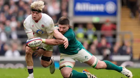 PA Media England's Henry Pollock tackled by Ireland's Joe McCarthy during the Guinness Men's Six Nations match at the Allianz Stadium Twickenham, London. Picture date: Saturday February 21, 2026.