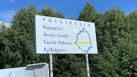 Roz Rapp A sign which reads "Arctic Circle" in various languages