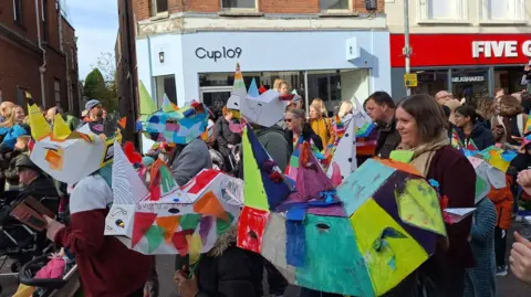 Denise Maisner Children in rhino costumes taking part in puppet festival