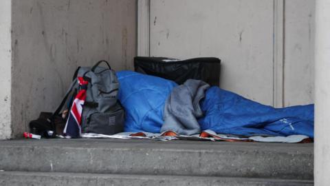 A homeless person sleeping