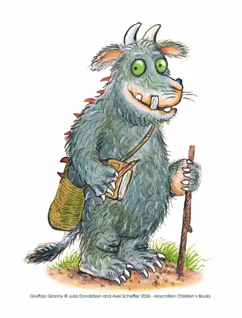 Axel Scheffler/Macmillan Children's Books An illustration of Gruffalo Granny, with grey body hair and horns on her head, holding a stick while carrying a notepad and pencil