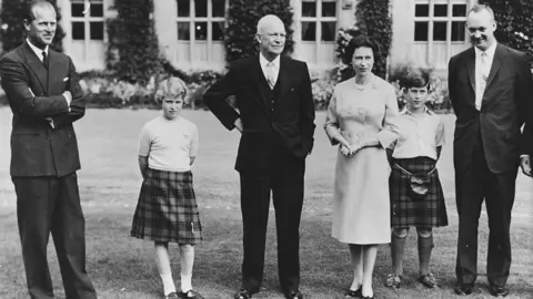 President Eisenhower (centre) with the British Royal family (L-R) Prince Philip, Princess Anne, HM Queen Elizabeth, Prince Charles and Captain John Eisenhower, at Balmoral Castle, Scotland, September 1959. (Photo by Fox Photos/Hulton Archive/Getty Images)