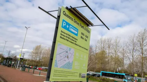 The totem at the entrance to the car park at Queens Drive in warmer times