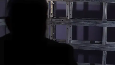 A sillhouette of Paul's face, we have disguised his identity to protect the identity of his child 