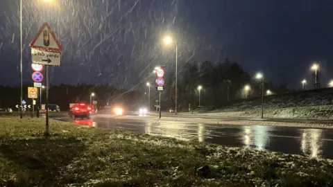Sam Read/BBC Heavy rain fell in Corby Northamptonshire.