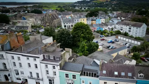 BBC aerial changeable  of Tenby showing the town's colourful terraced lodging  the and oversea  successful  the  distance