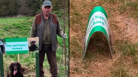 Vernatt's Nature Reserve A composite image with a man in a gillet, green top, brown trousers and a cap and wearing gloves standing next to a 'Malc and Sammy's Orchard' sign in a field. Underneath the sign is a brown cocker spaniel with its tongue out. On the right is the same sign bent in half and laying on the floor. 