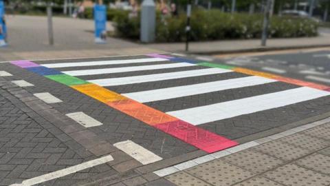 Colourful zebra crossing with rainbow-coloured rectangles 