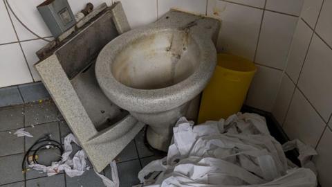 Image shows damage to public toilets