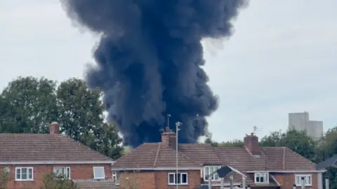 Plume of black smoke.