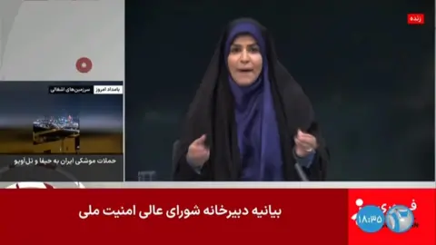 Newsreader reacting as blast happens