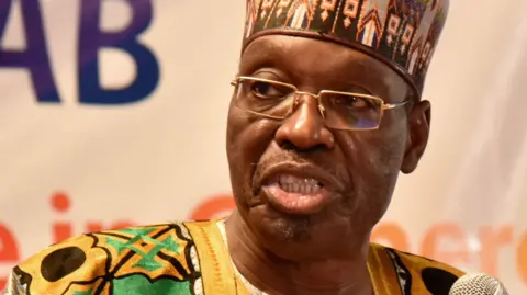 In 2021, the then-Minister of Communication, Issa Tchiroma Bakary, attends "Technology Innovation Day" in Yaoundé.