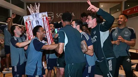 Arsenal celebrate with fake trophy