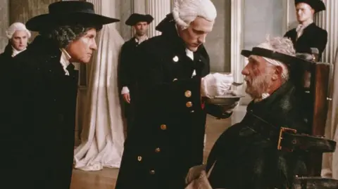 Getty Images Still from the film Madness of King George, showing the king being fed while strapped into a chair
