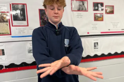 Jon Wright/BBC Toby showing the sign for "whale"