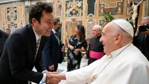 Reuters/ VATICAN MEDIA Divisione Foto Pope Francis greets Jimmy Fallon as he meets with comedians during a cultural event at the Vatican, June 14, 2024