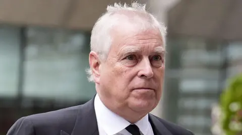 AFP via Getty Images A headshot of Prince Andrew who looks to the right of the camera. The background is blurred
