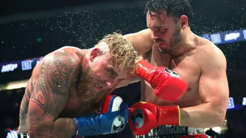 Getty Images Chavez Jr punching Jake Paul during a boxing match