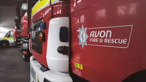 The front of an Avon Fire & Rescue fire truck with the service's logo on it.