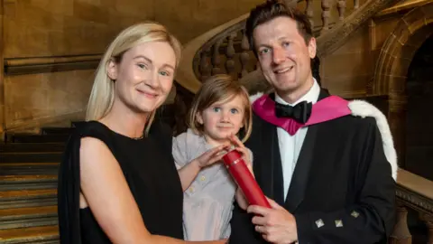 New doctor Calum MacDonald, pictured with his wife and daughter.