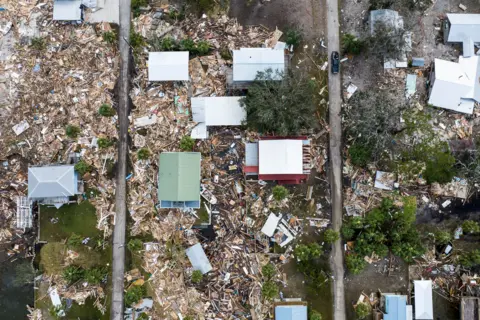 Chandan Khanna/AFP An aerial photo of damaged homes after Hurricane Helen made landfall in Horseshoe Beach, Florida, on September 28, 2024.