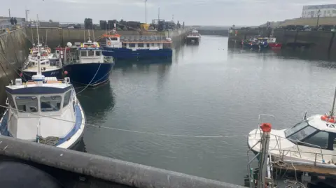 Seahouses harbour with lots of boats 