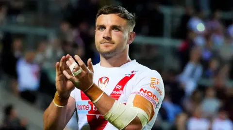 St Helens captain Matty Lees clapping fans after a game in 2025