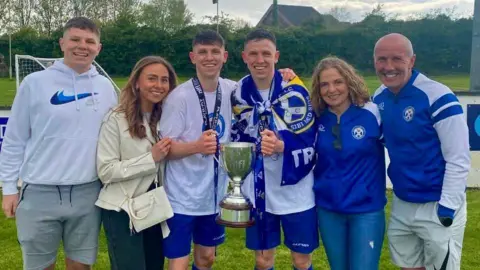 Pictured L-R Cahir (brother), Aoife (sister), Tiarnán and Ruairi, Sharon and Mark Boorman
