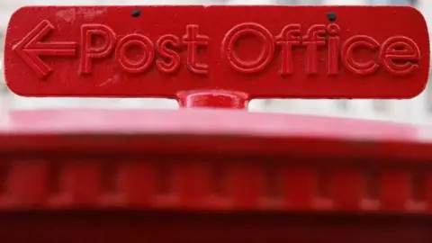 Getty Images An image of the Post Office logo on top of a postbox