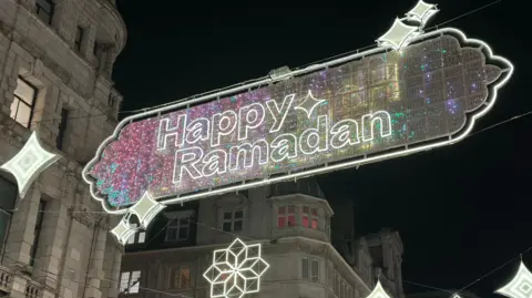 Festive lighting hung in central London with the wording Happy Ramadan.