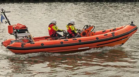 Getty Close up of RNLI staff on a lifeboat in the sea