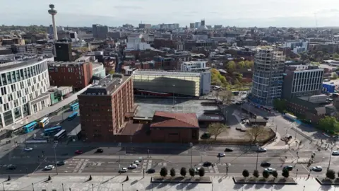 Merseyside Police An aerial shot of Canning Place in Liverpool, the Radio City Tower can be seen in the background and Liverpool ONE to the left of the building and the Baltic Triangle to the right
