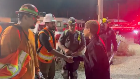LA Mayor Karen Bass shaking hands with rescued workers 