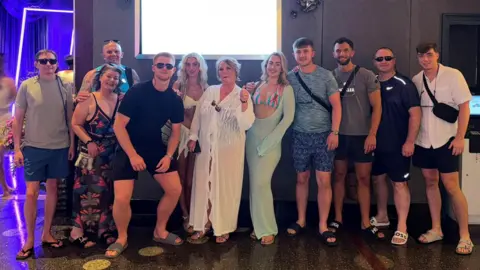 A group of family and friends from Liverpool posing for a picture outside a nightclub in the US as they soak up the World Cup atmosphere.
