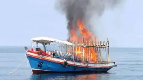 Surat Thani Provincial Public Relations Office A small boat with a large fire seen on board 