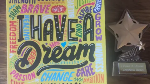 Lucas The front of the 'I Have a Dream' poetry book which is yellow and a star beside it. 