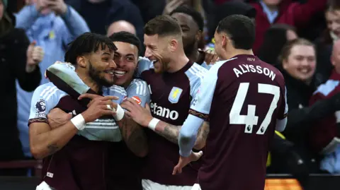 Tyrone Mings celebrates with Aston Villa team-mates