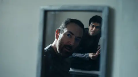 Jailbroken Films A man stares in a mirror