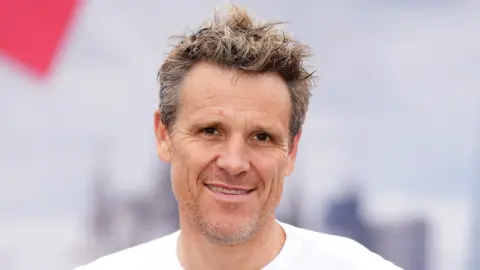 PA Media Former Great Britain Olympic Rower James Cracknell poses ahead of running the Virgin Money London Marathon in October 2021.