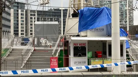 BBC Police tape sealing off access to silver stairs that lead to the city star slyer ride.