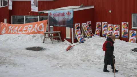 Getty Images Campaign posters hang outside of the polling station in Ilulissat, Greenland