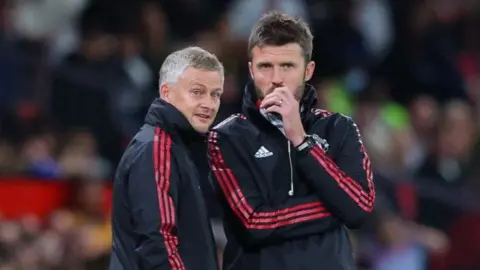 Michael Carrick (right) and Ole Gunnar Solskjaer were both interviewed earlier this month to replace Ruben Amorim at Manchester United